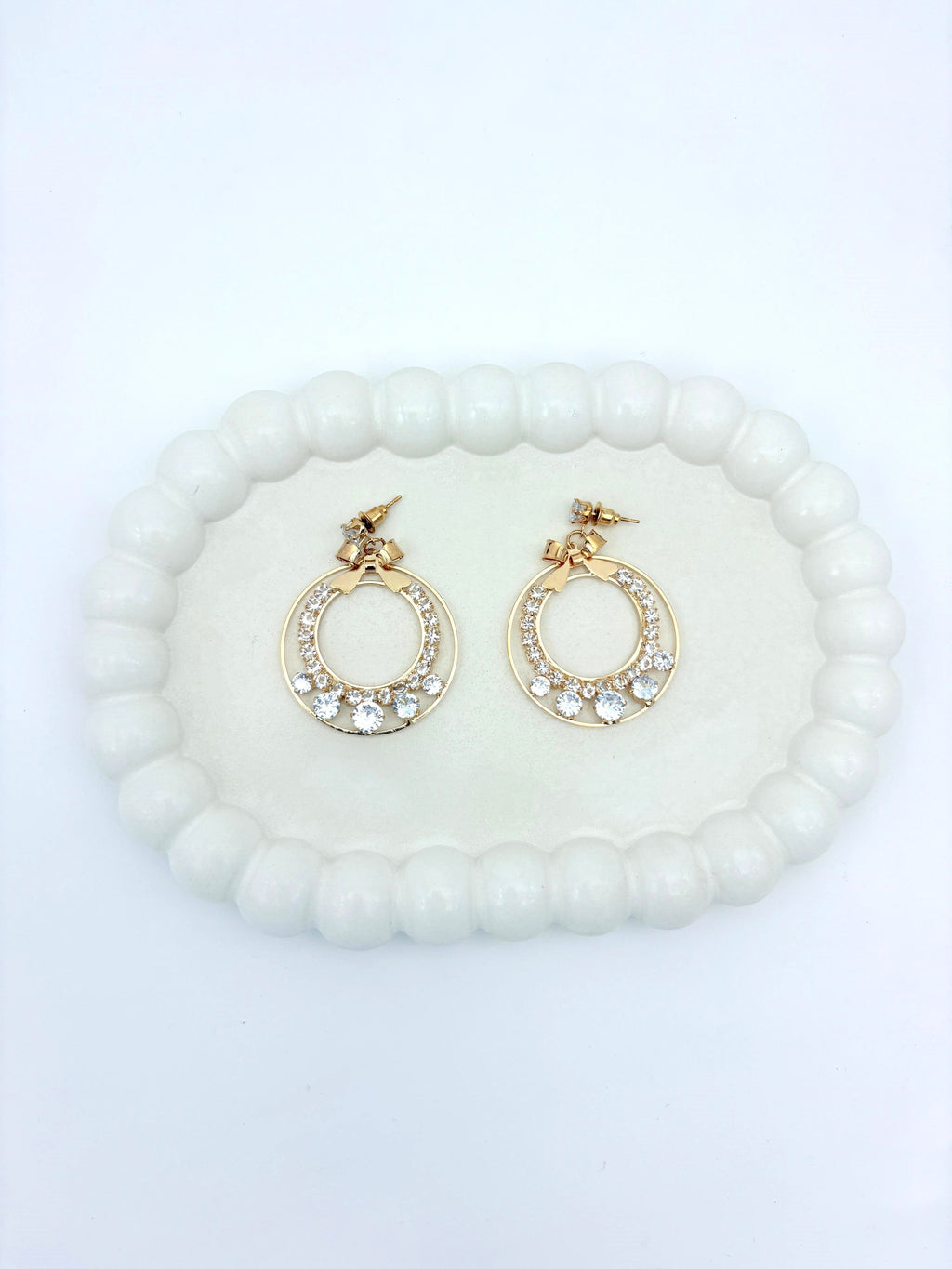 AD BOW GOLD EARRING