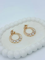 AD BOW GOLD EARRING