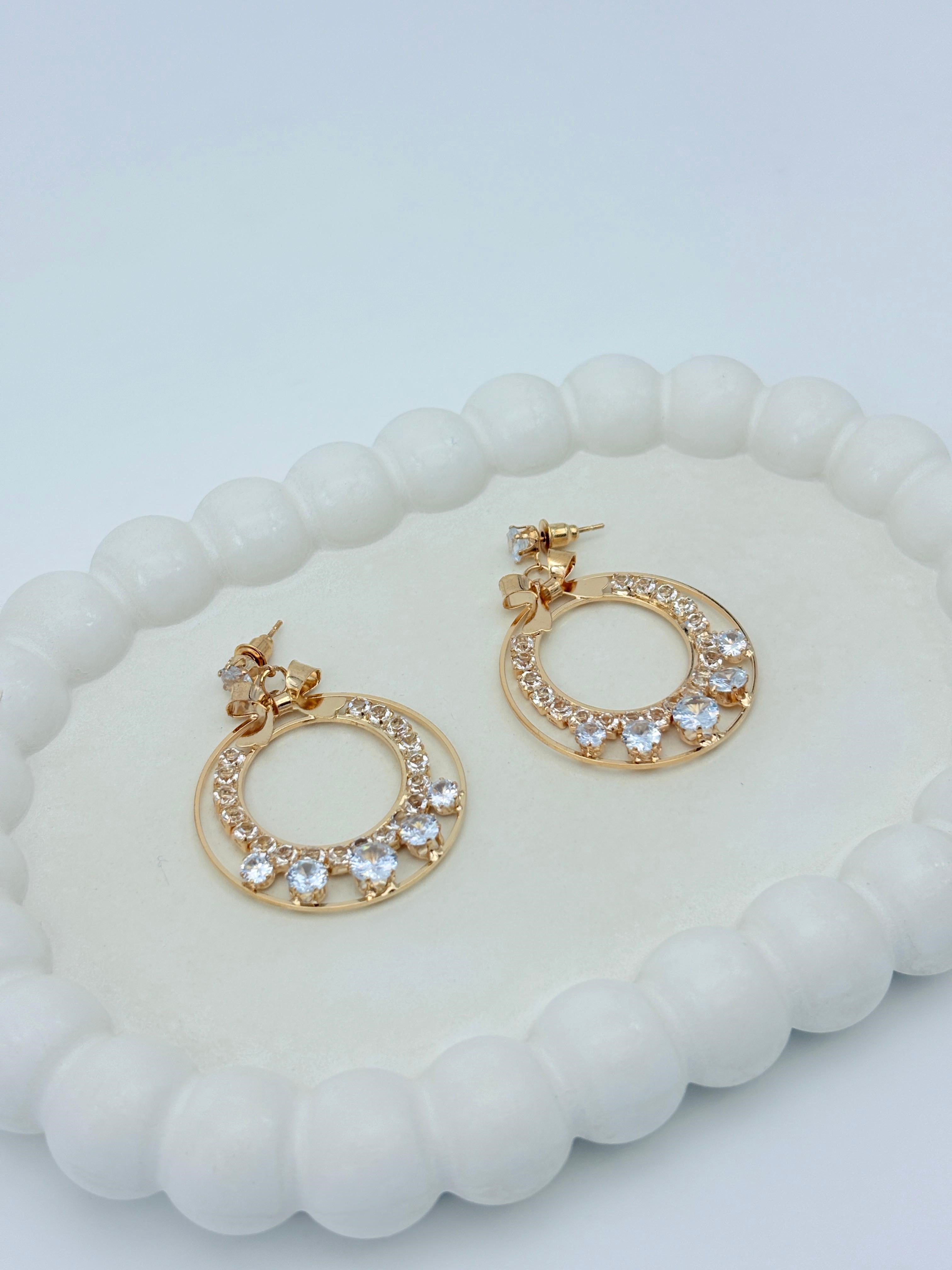 AD BOW GOLD EARRING
